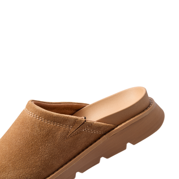 Vista Luxe Mariana suede clog facing left in close up showing the closed toe and cushioned footbed