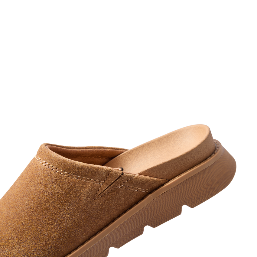 Vista Luxe Mariana suede clog facing left in close up showing the closed toe and cushioned footbed