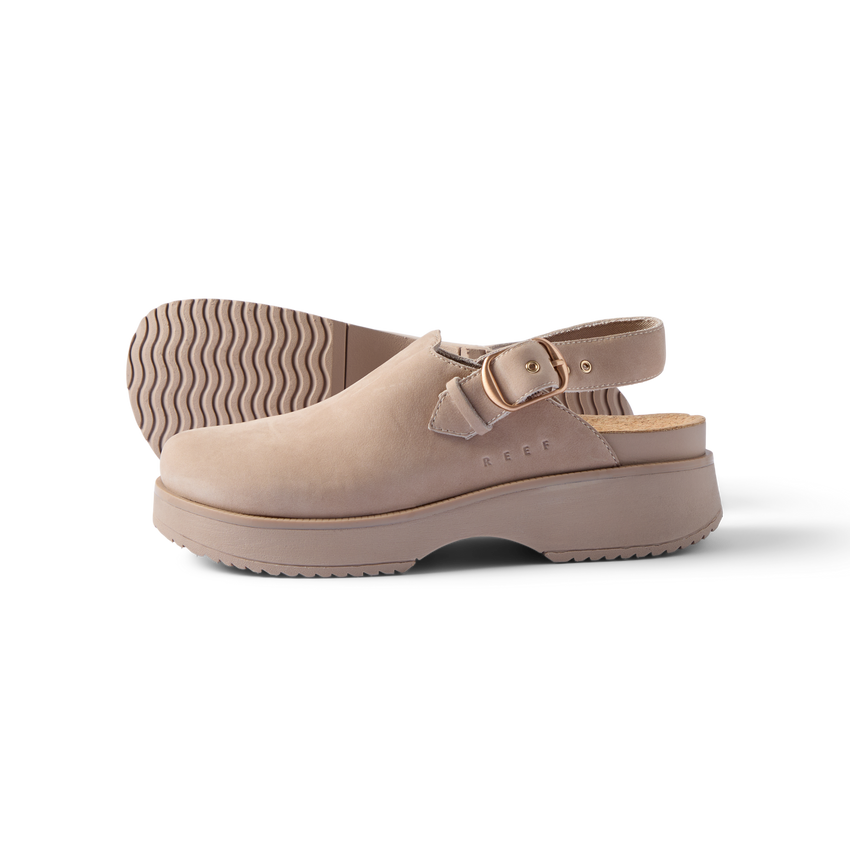 Side view of beige Vista Skye Rosa clog with adjustable backstrap, showcasing durable sole and comfort design features.