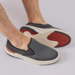 Del Mar Slip On facing right, men's black and grey sneaker with breathable mesh, cushioned sole, and slip-on comfort.