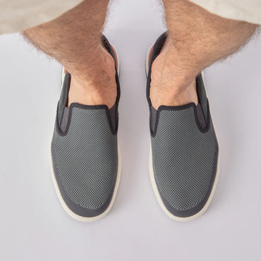 Del Mar Slip On facing forward, men's black and grey slip-on sneaker with lightweight mesh upper and cushioned sole for all-day comfort.